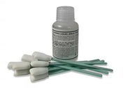 Bottle of cleaning liquid with cotton swabs on a white background