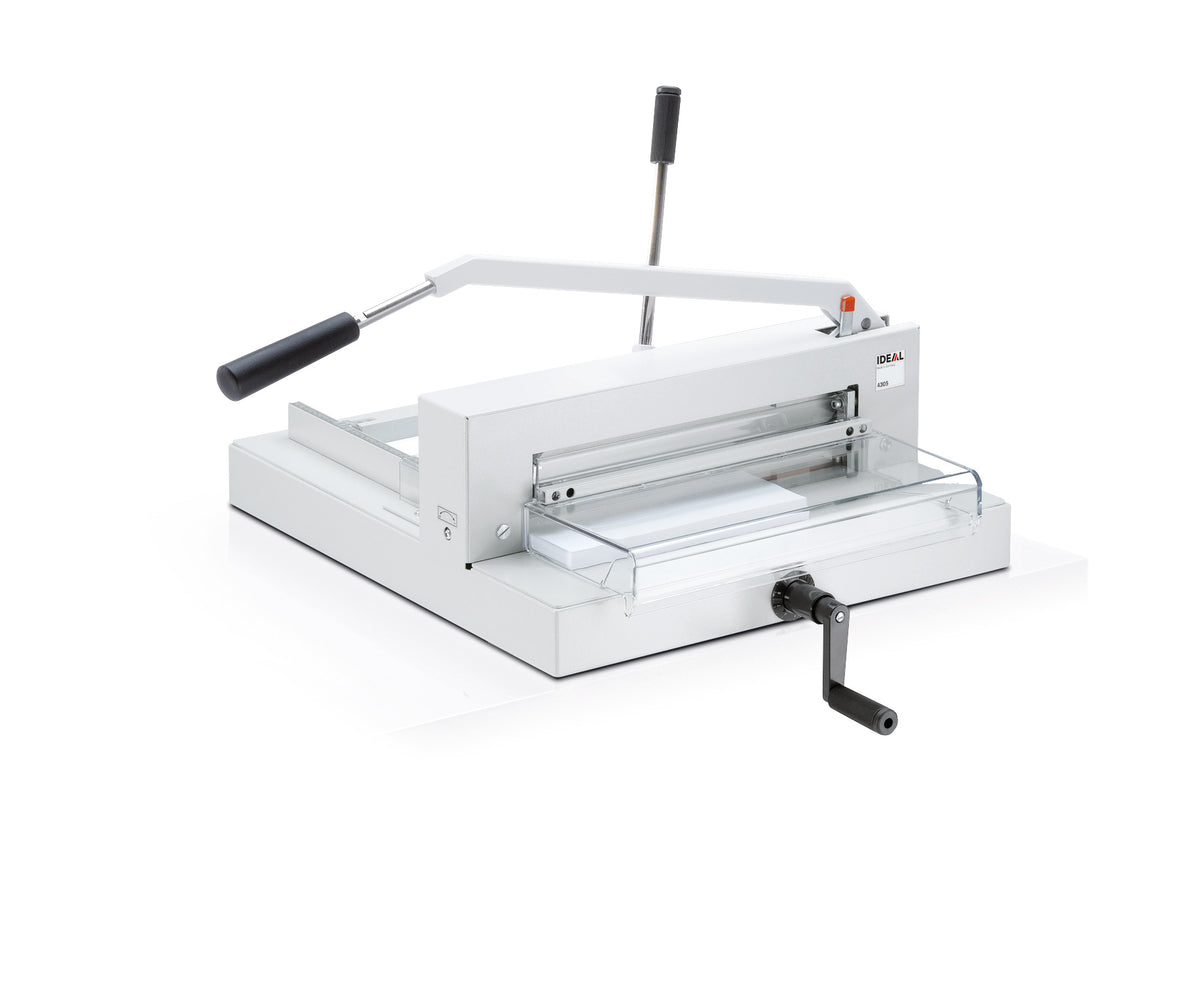 An IDEAL 4305 heavy duty manual guillotine, predominantly white and silver in color, with a transparent safety guard and a hand crank.
