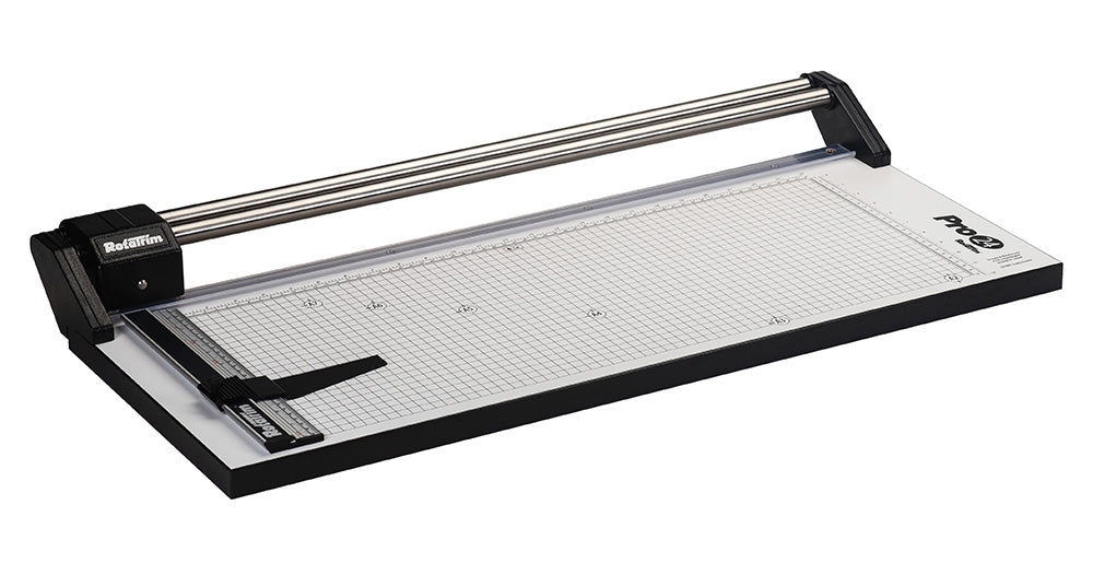 A RotaTrim Pro Series paper cutter with a metal head, black handle, and a clear baseplate with grid lines.