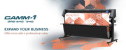 Cameo cutting machine with geometric patterned paper on a white background