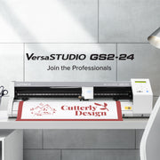 Roland VersaSTUDIO GS2-24 digital printing machine with a printed banner displaying 'Gutterly Design' on a gray tiled wall background.