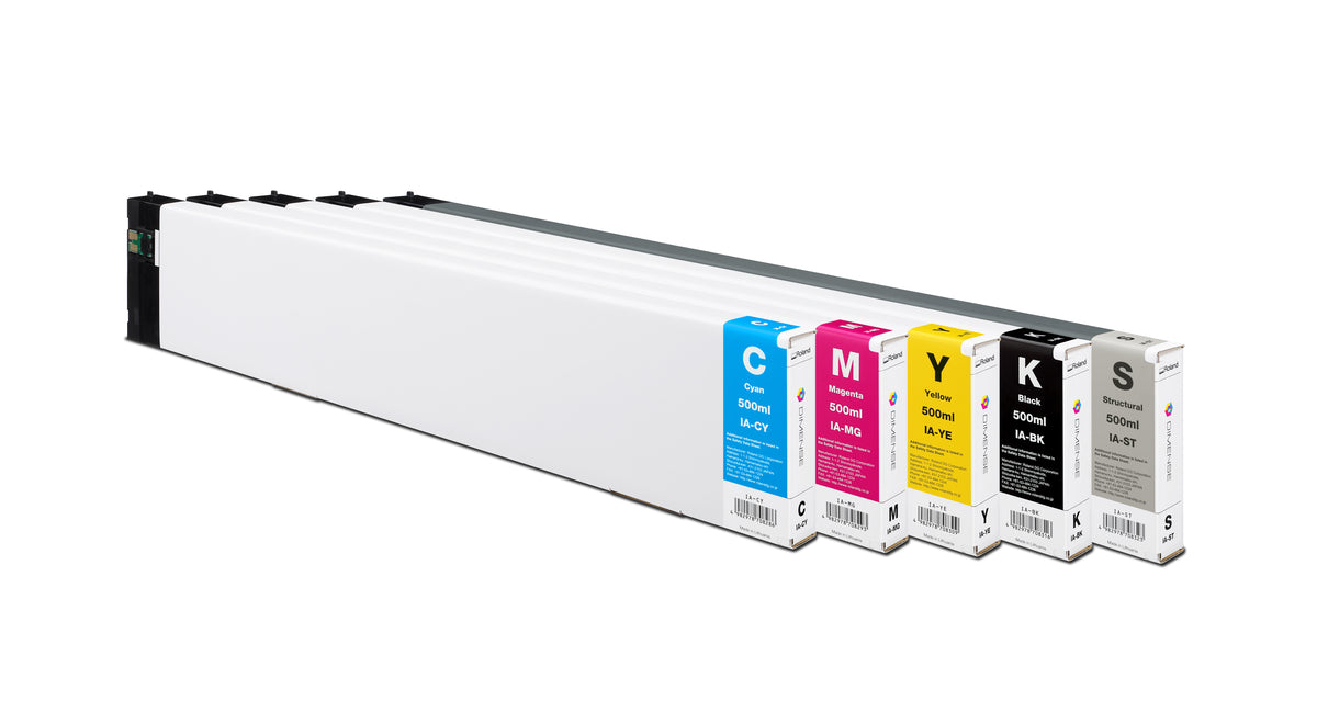 A long white continuous ink supply cartridge shown at an angle on a white background, with five ink tanks visible along the front labeled C, M, Y, K, and S.