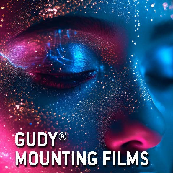 Artistic depiction of a face with colorful makeup and 'Gudy Mounting Films' text.
