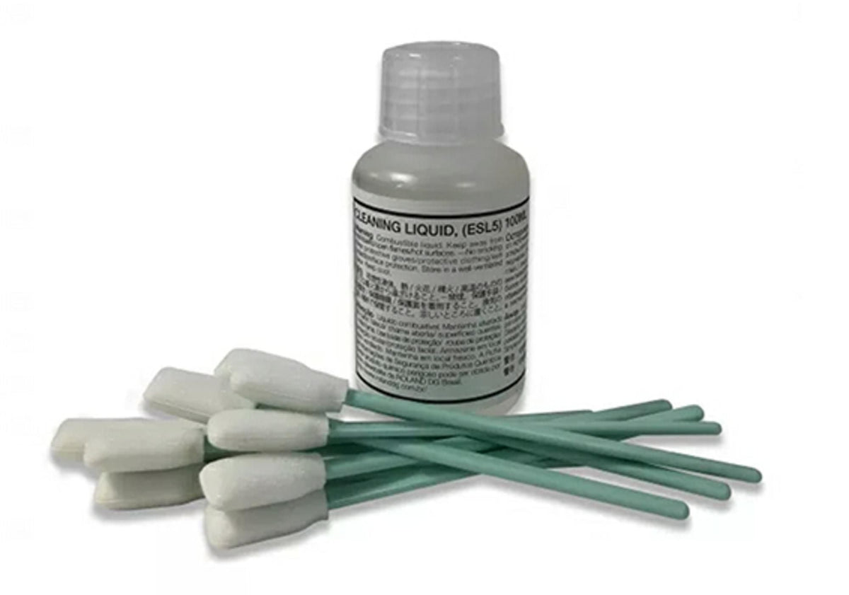 Bottle of cleaning liquid with cotton swabs on a white background