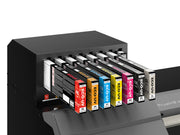 Collection of ink cartridges with visible brand names on a printer.