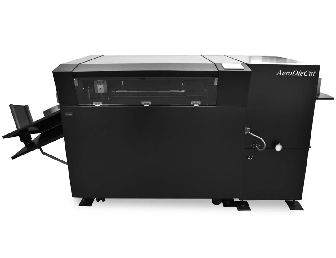 Black Uchida AeroDieCut paper cutter and perforator machine with a touch screen interface and paper feeding mechanism.