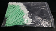 A pack of foam cleaning swabs with green and white tips, sealed in a plastic bag.
